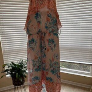 Girls casual dress with ruffles at the top.